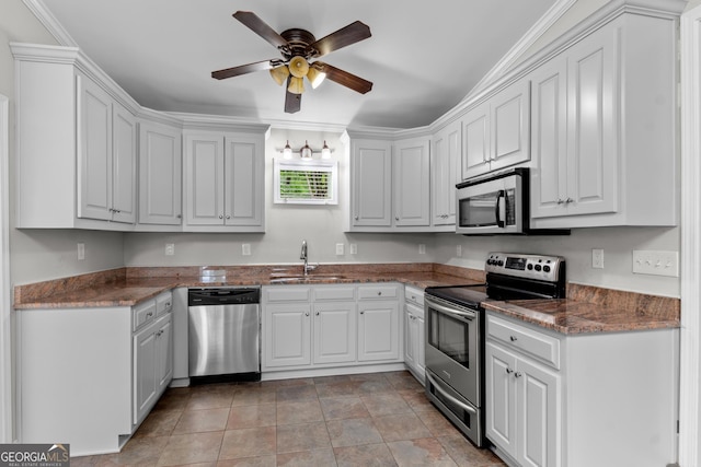 160 Birch Rd, Covington, GA 30014 - kitchen featuring appliances with stainless steel finishes, a sink, ceiling fan, and white cabinets