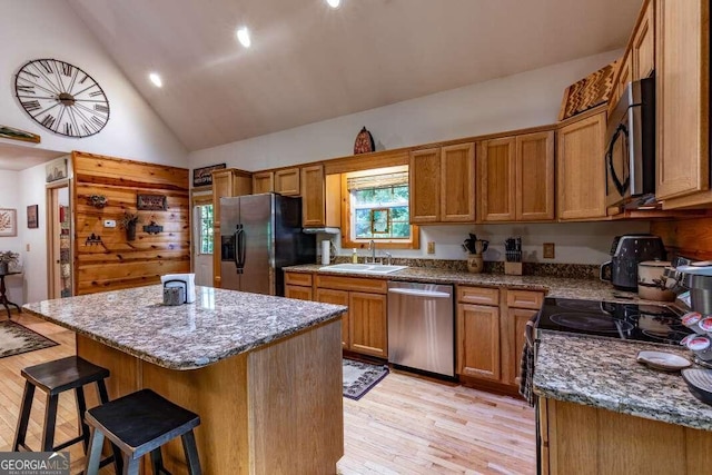 284 Summit Way Unit 19, Blairsville, GA 30512 - kitchen featuring stainless steel appliances, light wood finished floors, a breakfast bar, a center island, and healthy amount of natural light