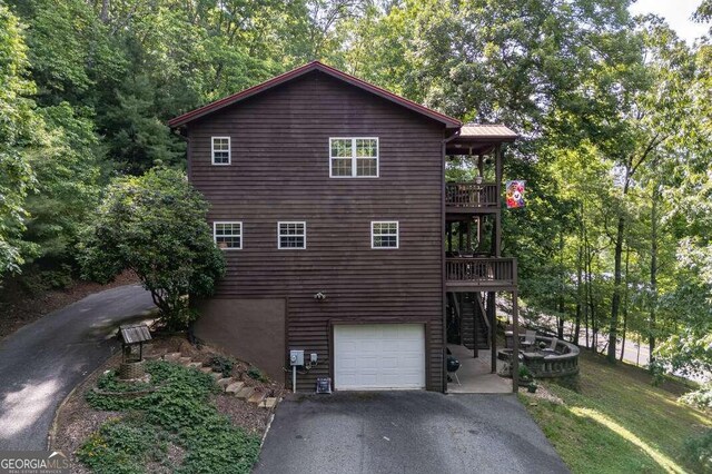 284 Summit Way Unit 19, Blairsville, GA 30512 - view of side of property with stairs, a garage, driveway, and a wooden deck