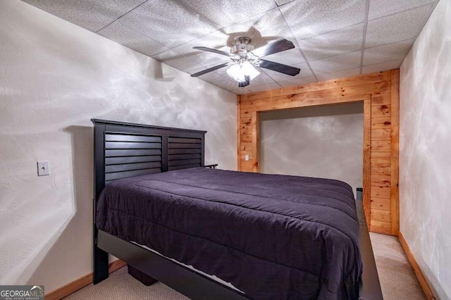 284 Summit Way Unit 19, Blairsville, GA 30512 - carpeted bedroom featuring wooden walls, a paneled ceiling, and a ceiling fan