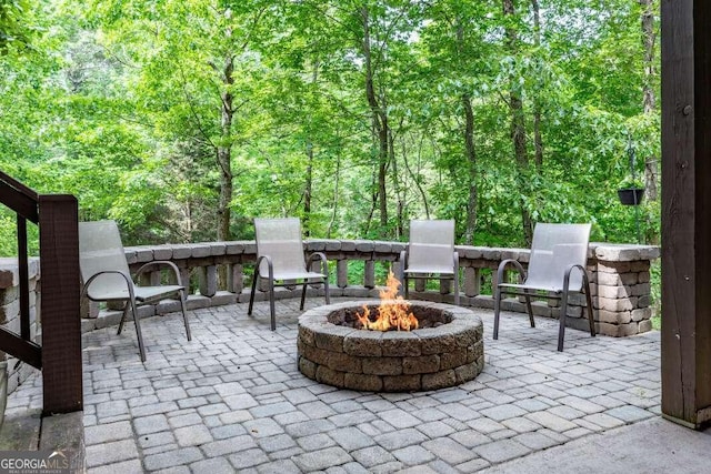 284 Summit Way Unit 19, Blairsville, GA 30512 - view of patio with a fire pit and a forest view