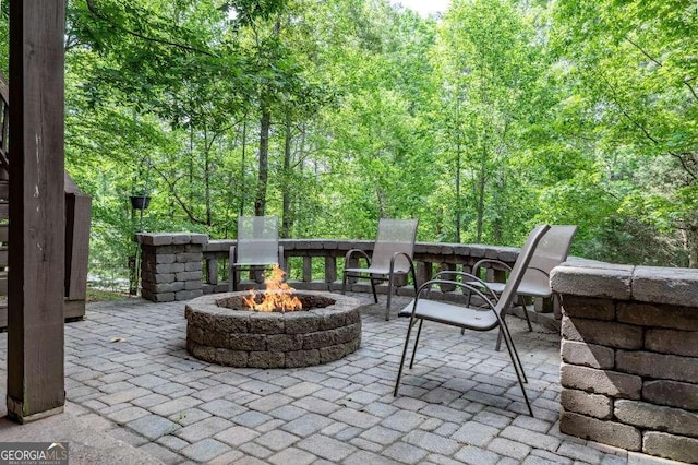 284 Summit Way Unit 19, Blairsville, GA 30512 - view of patio featuring a fire pit and a view of trees