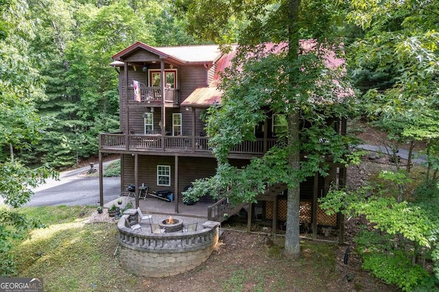 284 Summit Way Unit 19, Blairsville, GA 30512 - rear view of property featuring an outdoor fire pit, a patio area, a balcony, a wooden deck, and stairway