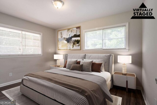 2311 Cherry Blossom Dr SW, Atlanta, GA 30331 - bedroom featuring multiple windows, dark wood finished floors, and baseboards
