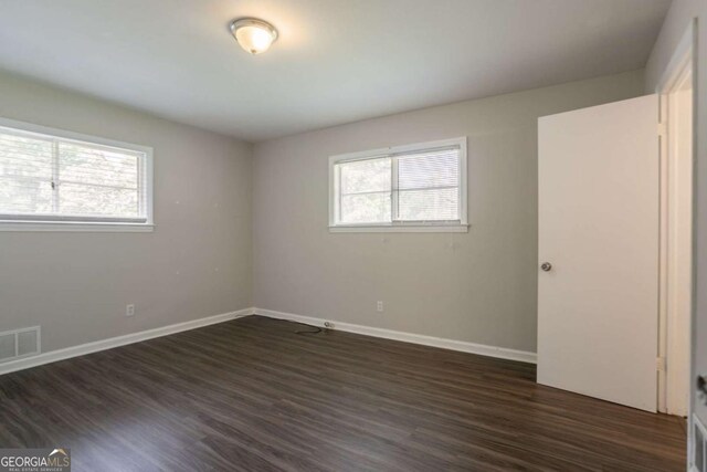 2311 Cherry Blossom Dr SW, Atlanta, GA 30331 - unfurnished bedroom featuring dark wood-style flooring and baseboards