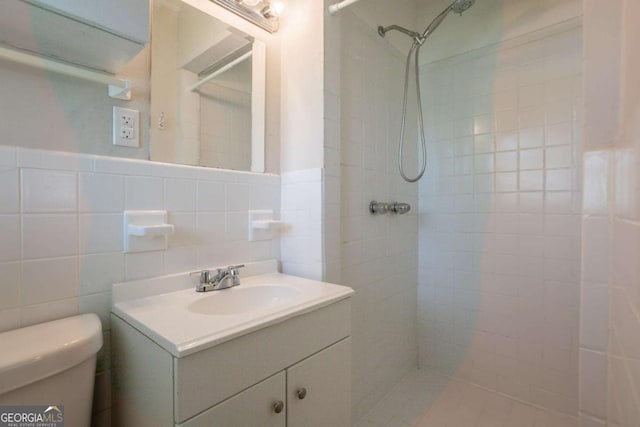 2311 Cherry Blossom Dr SW, Atlanta, GA 30331 - bathroom with a tile shower, toilet, vanity, and tile walls