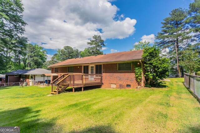 2311 Cherry Blossom Dr SW, Atlanta, GA 30331 - rear view of property with a wooden deck, crawl space, and brick siding