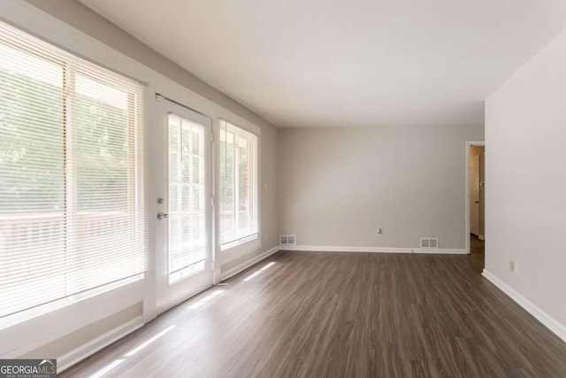 2311 Cherry Blossom Dr SW, Atlanta, GA 30331 - unfurnished room with dark wood-style floors, healthy amount of natural light, and baseboards