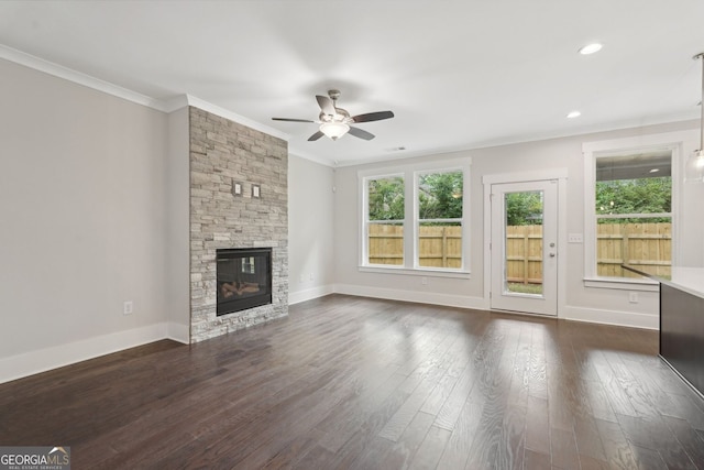 1158 Welch St SW, Atlanta, GA 30310 - unfurnished living room featuring a ceiling fan, crown molding, healthy amount of natural light, a fireplace, and dark wood finished floors