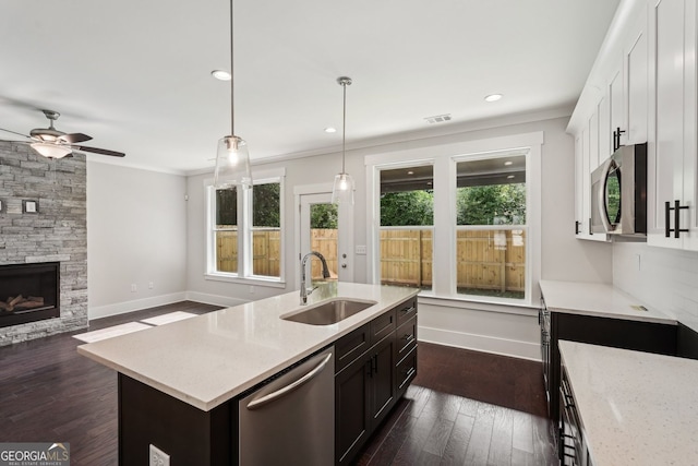 1158 Welch St SW, Atlanta, GA 30310 - kitchen with appliances with stainless steel finishes, ceiling fan, crown molding, healthy amount of natural light, and dark wood finished floors