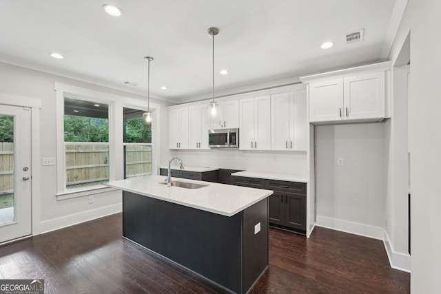 1158 Welch St SW, Atlanta, GA 30310 - kitchen featuring stainless steel microwave, white cabinetry, decorative light fixtures, dark wood finished floors, and recessed lighting