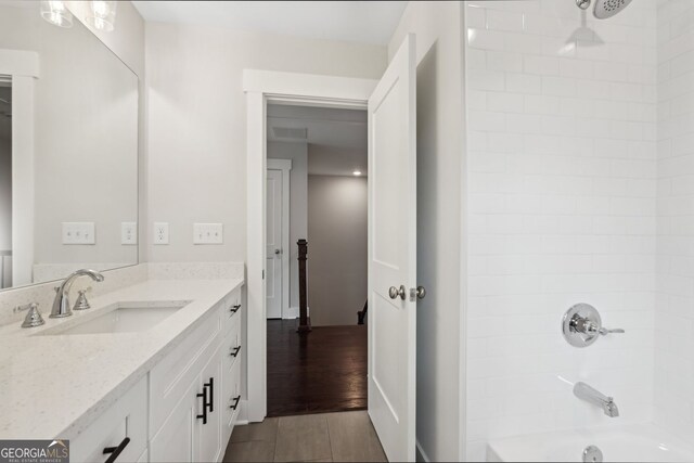 1158 Welch St SW, Atlanta, GA 30310 - full bath with vanity, shower / bathtub combination, and wood finished floors