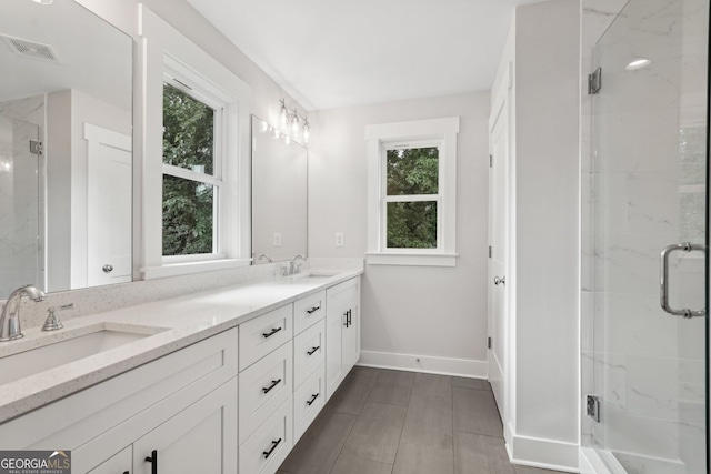 1158 Welch St SW, Atlanta, GA 30310 - full bathroom with double vanity, healthy amount of natural light, and a stall shower