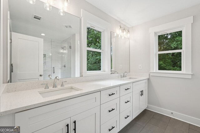 1158 Welch St SW, Atlanta, GA 30310 - bathroom with double vanity, a marble finish shower, and tile patterned floors