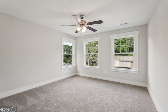 1158 Welch St SW, Atlanta, GA 30310 - spare room with healthy amount of natural light, carpet floors, and a ceiling fan