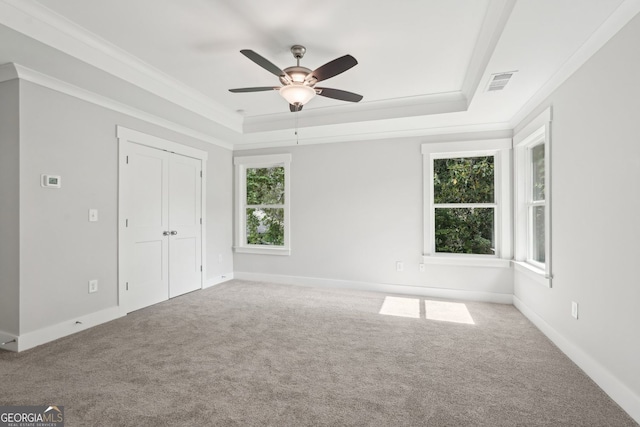 1158 Welch St SW, Atlanta, GA 30310 - unfurnished bedroom with a tray ceiling, carpet flooring, ornamental molding, a ceiling fan, and a closet