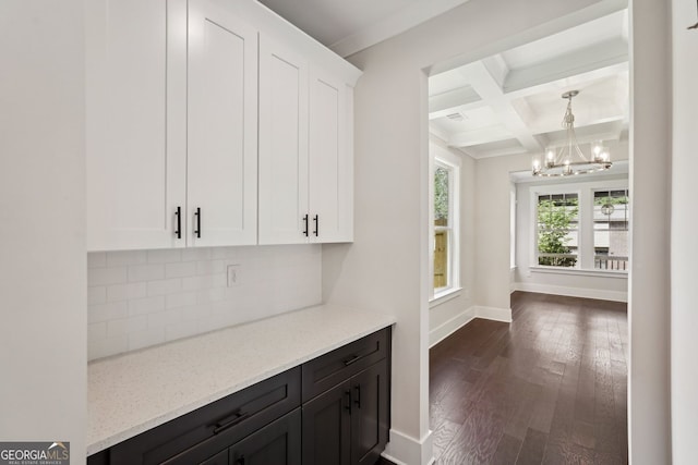 1158 Welch St SW, Atlanta, GA 30310 - kitchen featuring a chandelier, tasteful backsplash, white cabinets, light stone counters, and dark wood-type flooring