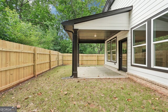 1158 Welch St SW, Atlanta, GA 30310 - fenced backyard featuring a patio area