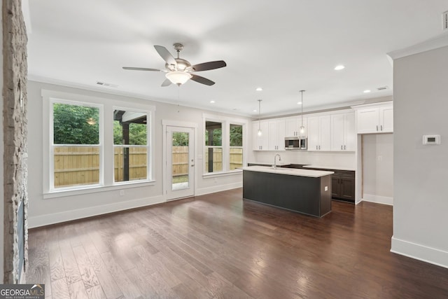 1158 Welch St SW, Atlanta, GA 30310 - kitchen with stainless steel microwave, ceiling fan, healthy amount of natural light, light countertops, and recessed lighting
