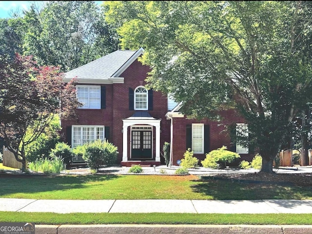 2674 Misty Rock Cv, Dacula, GA 30019 - view of front of home with a front yard and brick siding