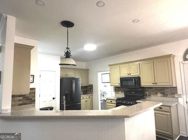 2674 Misty Rock Cv, Dacula, GA 30019 - kitchen featuring black appliances, tasteful backsplash, a peninsula, and hanging light fixtures