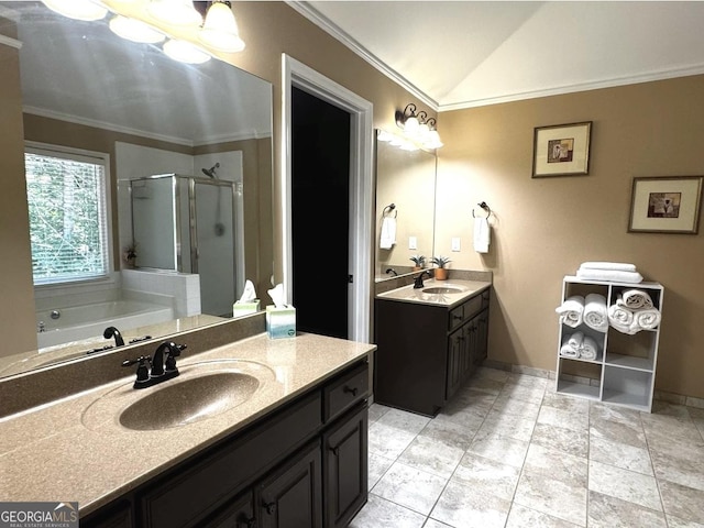 2674 Misty Rock Cv, Dacula, GA 30019 - bathroom with a stall shower, two vanities, crown molding, a garden tub, and lofted ceiling