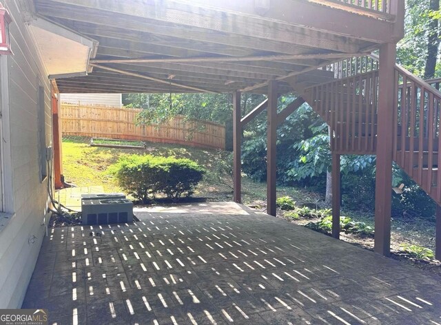 2674 Misty Rock Cv, Dacula, GA 30019 - view of patio featuring stairway, cooling unit, and a carport