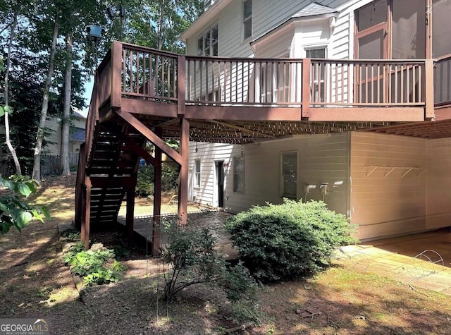 2674 Misty Rock Cv, Dacula, GA 30019 - view of side of home with stairs and a wooden deck