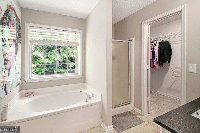 1478 Interlaken Pass, Jonesboro, GA 30238 - bathroom featuring a shower stall, a tub with jets, and healthy amount of natural light