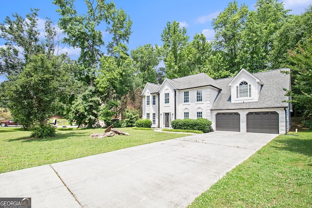 1478 Interlaken Pass, Jonesboro, GA 30238 - view of front facade with driveway, a front lawn, roof with shingles, and an attached garage
