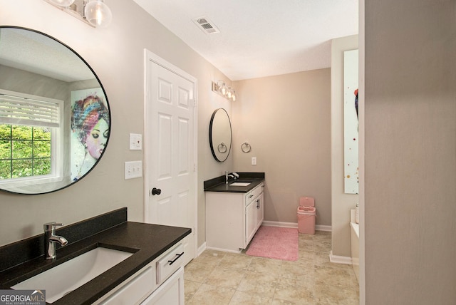 1478 Interlaken Pass, Jonesboro, GA 30238 - bathroom featuring two vanities, a bathtub, and tile patterned floors