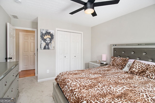 1478 Interlaken Pass, Jonesboro, GA 30238 - bedroom with light colored carpet, a closet, and a ceiling fan