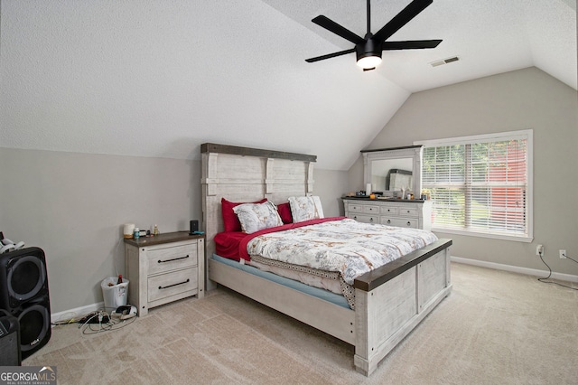 1478 Interlaken Pass, Jonesboro, GA 30238 - bedroom with lofted ceiling, light colored carpet, a ceiling fan, and a textured ceiling