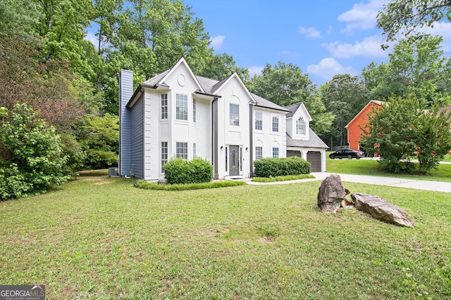1478 Interlaken Pass, Jonesboro, GA 30238 - view of front of home featuring a chimney, concrete driveway, and a front lawn