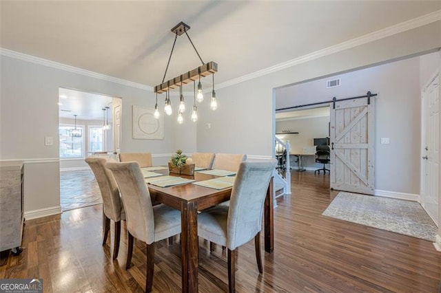 2304 Mitford Ct, Dacula, GA 30019 - dining room featuring dark wood-type flooring, a barn door, ornamental molding, and baseboards