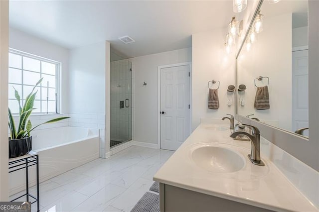2304 Mitford Ct, Dacula, GA 30019 - full bath with marble look tiles, a garden tub, double vanity, and a shower stall