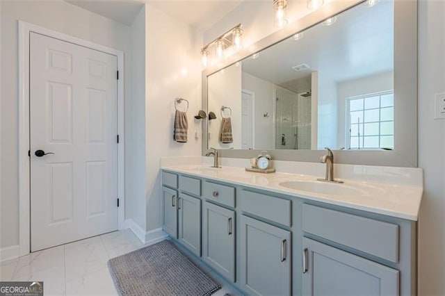 2304 Mitford Ct, Dacula, GA 30019 - bathroom with double vanity, a tile shower, marble look tile flooring, and baseboards