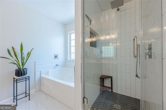 2304 Mitford Ct, Dacula, GA 30019 - bathroom featuring a stall shower, a bath, and marble finish flooring