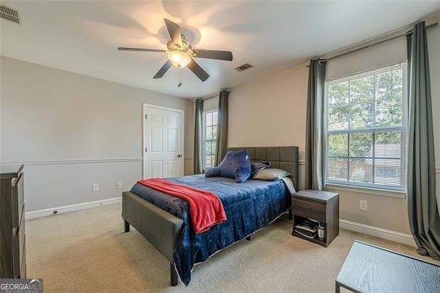 2304 Mitford Ct, Dacula, GA 30019 - bedroom with multiple windows, light colored carpet, and baseboards