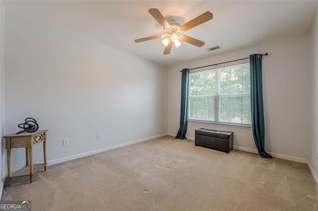 2304 Mitford Ct, Dacula, GA 30019 - spare room featuring carpet floors, ceiling fan, and baseboards