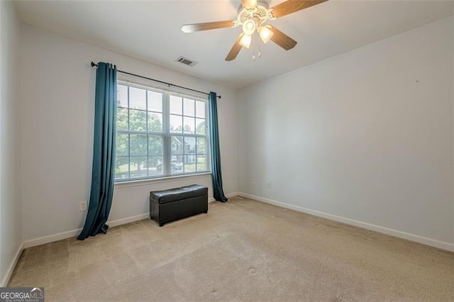 2304 Mitford Ct, Dacula, GA 30019 - spare room with light colored carpet, baseboards, and ceiling fan
