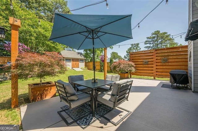 2304 Mitford Ct, Dacula, GA 30019 - view of patio with outdoor dining area and a grill