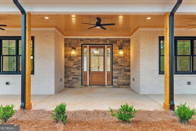225 Laurel Place Dr, Cornelia, GA 30531 - doorway to property with ceiling fan, brick siding, and a porch