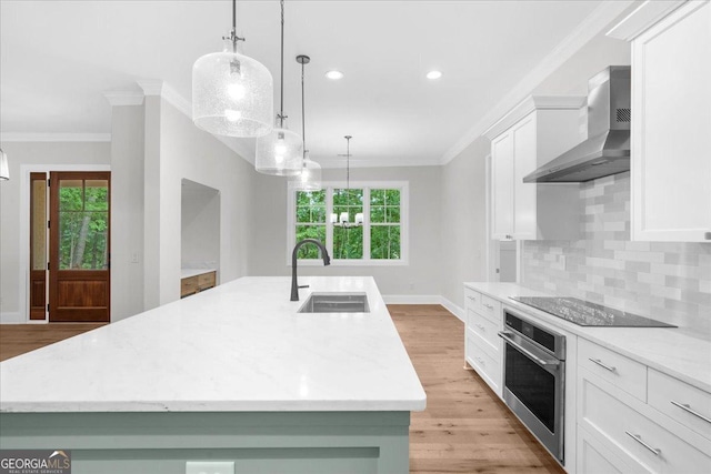 225 Laurel Place Dr, Cornelia, GA 30531 - kitchen featuring oven, wall chimney range hood, black electric cooktop, a sink, and crown molding