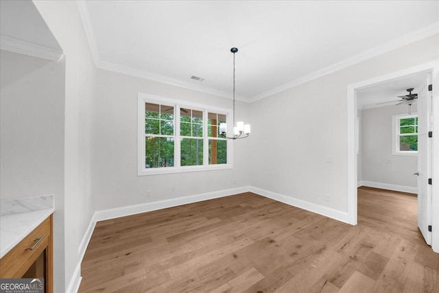 225 Laurel Place Dr, Cornelia, GA 30531 - unfurnished dining area with a chandelier, light wood-type flooring, crown molding, and baseboards