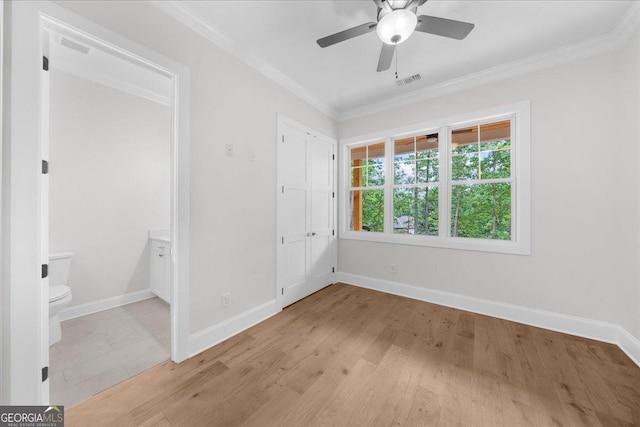 225 Laurel Place Dr, Cornelia, GA 30531 - unfurnished bedroom featuring ornamental molding, light wood-type flooring, baseboards, and ensuite bath