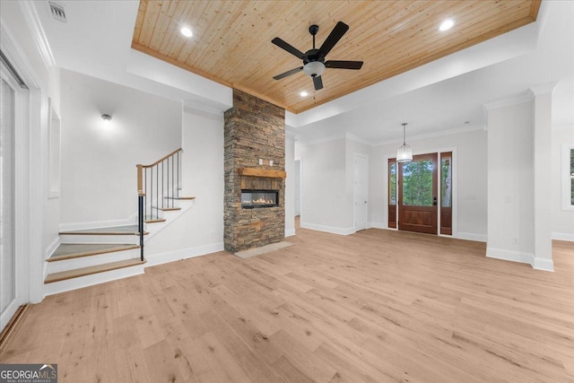 225 Laurel Place Dr, Cornelia, GA 30531 - unfurnished living room with wooden ceiling, light wood finished floors, ceiling fan, a stone fireplace, and stairs