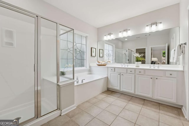 550 Mae Ln, Alpharetta, GA 30004 - full bathroom featuring a stall shower, a bath, double vanity, and tile patterned floors