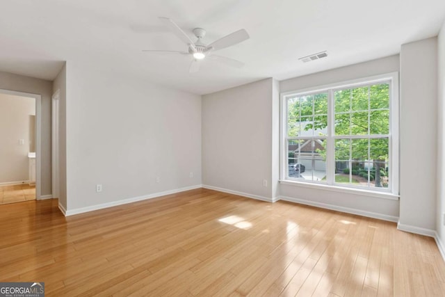 550 Mae Ln, Alpharetta, GA 30004 - unfurnished room featuring ceiling fan, baseboards, and light wood-type flooring