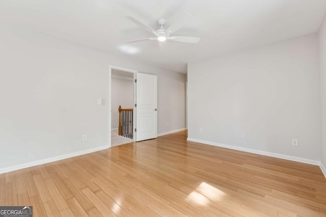 550 Mae Ln, Alpharetta, GA 30004 - spare room featuring ceiling fan, light wood-style flooring, and baseboards